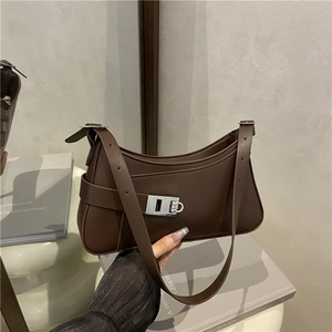 Minimalist brown crescent hobo bag with adjustable strap and silver buckle for women