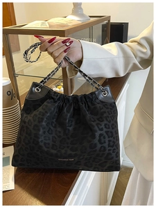 Detail of Creative Cat leopard print shoulder bag with silver chain and drawstring