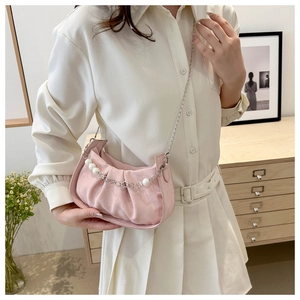 Pink pleated underarm bag with decorative pearls and silver metal chain detail