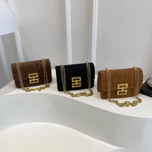 Three leopard print crossbody bags in brown, black and caramel with gold chain straps