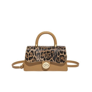 Chic leopard print flap handbag with gold rotating lock and adjustable shoulder strap