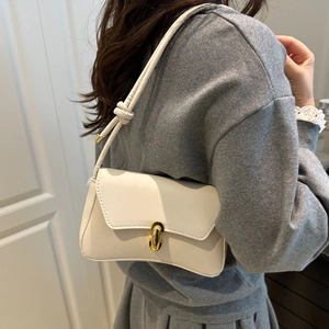 Chic white minimalist shoulder bag for women with golden twist lock and knot strap detail