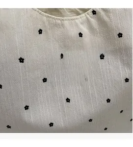 Detail of floral chiffon tote fabric with vertical texture and Nan Xiao Jie label