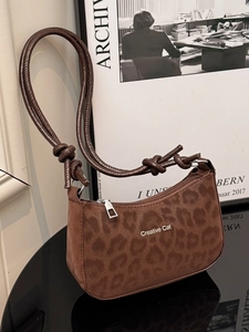 Brown leopard print shoulder bag with Creative Cat logo and knotted strap detail
