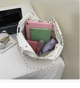Top view of large floral tote bag interior showing capacity for tablets and daily essentials