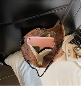 Top view of spacious brown corduroy tote interior showing room for tablet and essentials