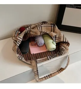 Detailed top view of a large brown checkered tote bag showing spacious interior capacity