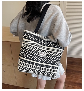 Close-up of the tribal geometric pattern and woven texture on this canvas tote bag