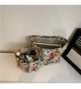 Detail view showing large and small floral jacquard tote bags with spacious interior capacity