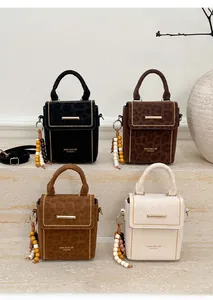 Collection of leopard print crossbody bags in multiple colors with beaded tassel charms