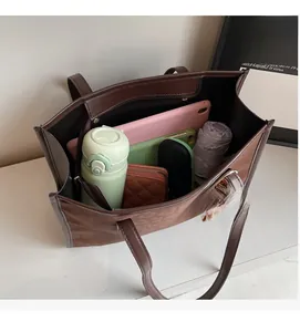 Spacious interior of leopard print tote bag showing daily essentials and storage