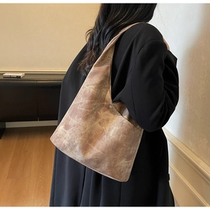 Close-up of vintage textured large capacity tote bag with minimalist metal snap closure