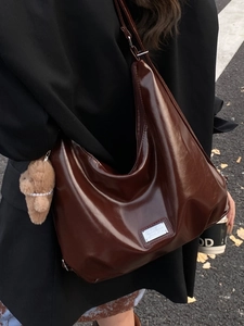 Large capacity dark brown patent leather hobo bag with a cute plush bear pendant