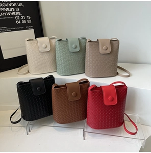 Detailed arrangement of woven leather bucket bags in six assorted stylish colors