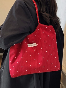 Large red floral chiffon tote bag with white flower patterns and woven shoulder strap