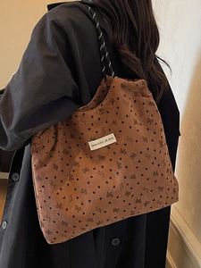 Brown corduroy tote bag with heart and bow patterns for women daily fashion use