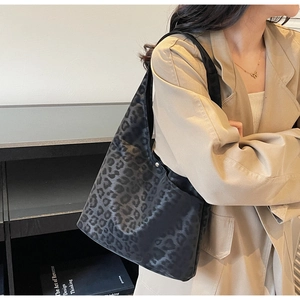 Detail view of large capacity leopard print hobo shoulder bag with matte finish