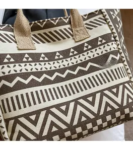 Close-up of Bohemian geometric pattern and textured canvas fabric on large tote bag