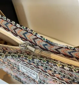 Close-up of smooth metal zipper and woven texture on this large ethnic tote bag