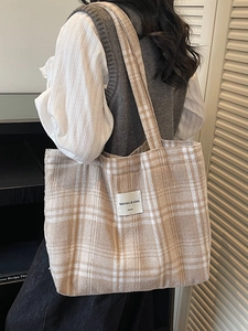 Classic large beige checkered tote bag shown on model in a Korean minimalist style