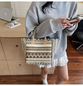 Detail of canvas tote bag with geometric brown and beige patterns for daily use