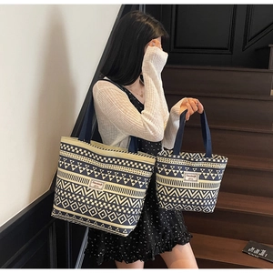 Close-up of geometric pattern canvas tote bags in a two-piece set for versatile use