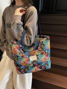 Ethnic style large tote bag with tropical leaf jacquard pattern and blue woven straps
