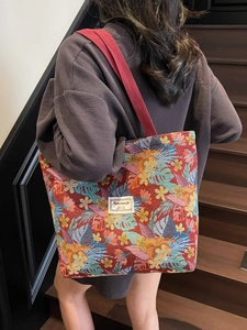 Ethnic style large tote bag with colorful floral patterns and canvas strap for women