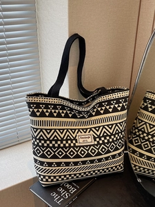 Large canvas tote bag with black and white geometric patterns and double handles