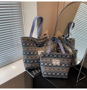 Close-up of ethnic style tote bags with detailed geometric patterns and woven texture