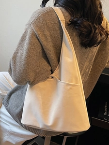 Minimalist beige matte tote bag for women showing a spacious design and side metal snap