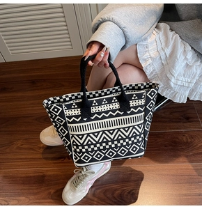 Detailed view of the ethnic geometric pattern on the durable canvas tote bag surface