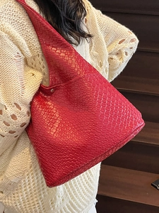 Red woven leather tote bag with Intrecciato pattern and stylish hobo design for women