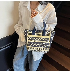 Detailed macro view of ethnic geometric pattern on thick canvas tote bag fabric