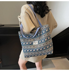 Ethnic pattern tote bag with wide straps shown on model for daily commuting style