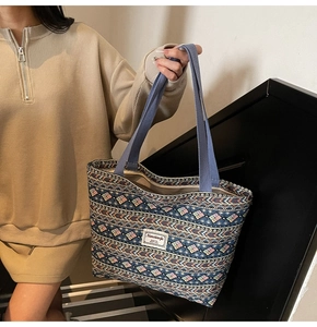 Close-up of bohemian geometric pattern tote bag with jacquard fabric and brand label