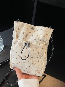 Cream corduroy phone bag with butterfly pattern and braided strap for women
