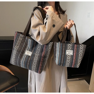 Ethnic knit tote set showing large shoulder bag and small handbag for size comparison