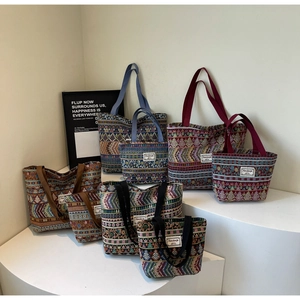 Detailed display of ethnic woven tote bags in various sizes and geometric patterns