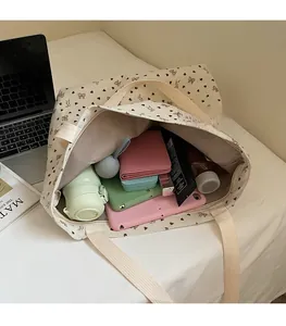Large capacity corduroy tote bag showing interior storage for tablets and essentials