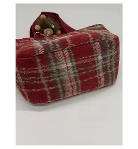 Detail shot of the widened base and vintage plaid woolen fabric on the tote bag