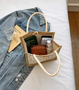 Linen tote bag interior showing capacity for wallet, makeup and mobile phone