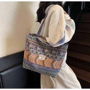Detailed view of the large ethnic style tote bag with colorful geometric patterns