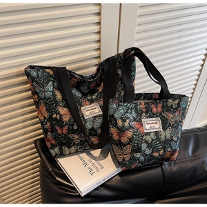 Detail of two-piece floral tote set featuring intricate butterfly jacquard weaving texture