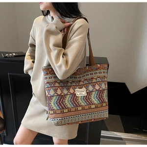Detail of colorful geometric ethnic jacquard pattern on a large canvas tote bag