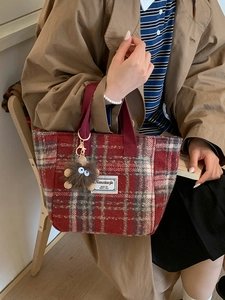 Retro red plaid wool tote bag with plush monster charm and comfortable woven handles
