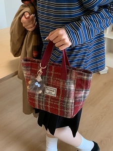 Retro red plaid wool tote bag with plush charm and woven label for autumn and winter style