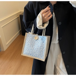 Lace floral lunch bag with rope handles and wooden button for daily storage