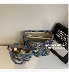 Detail view of large and small floral canvas tote bags showing storage capacity and lining