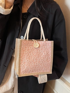 Pink linen tote bag with white floral embroidery, jute sides and rope handles for women